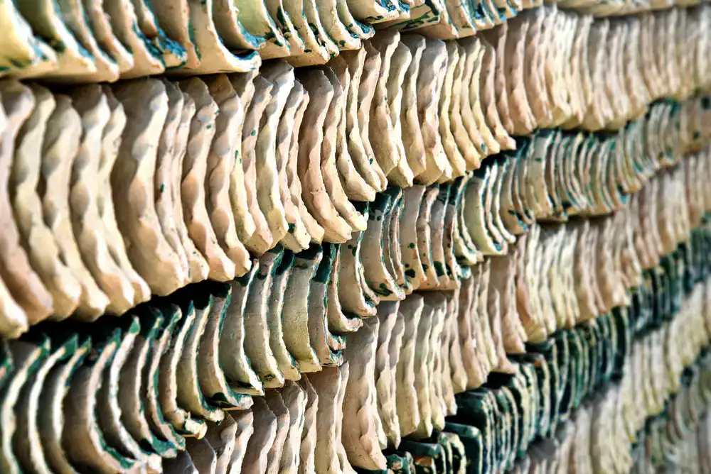 Stacked ceramic tiles showing the glossy edge and rich glaze texture